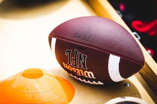 football-and-cone-on-wooden-table